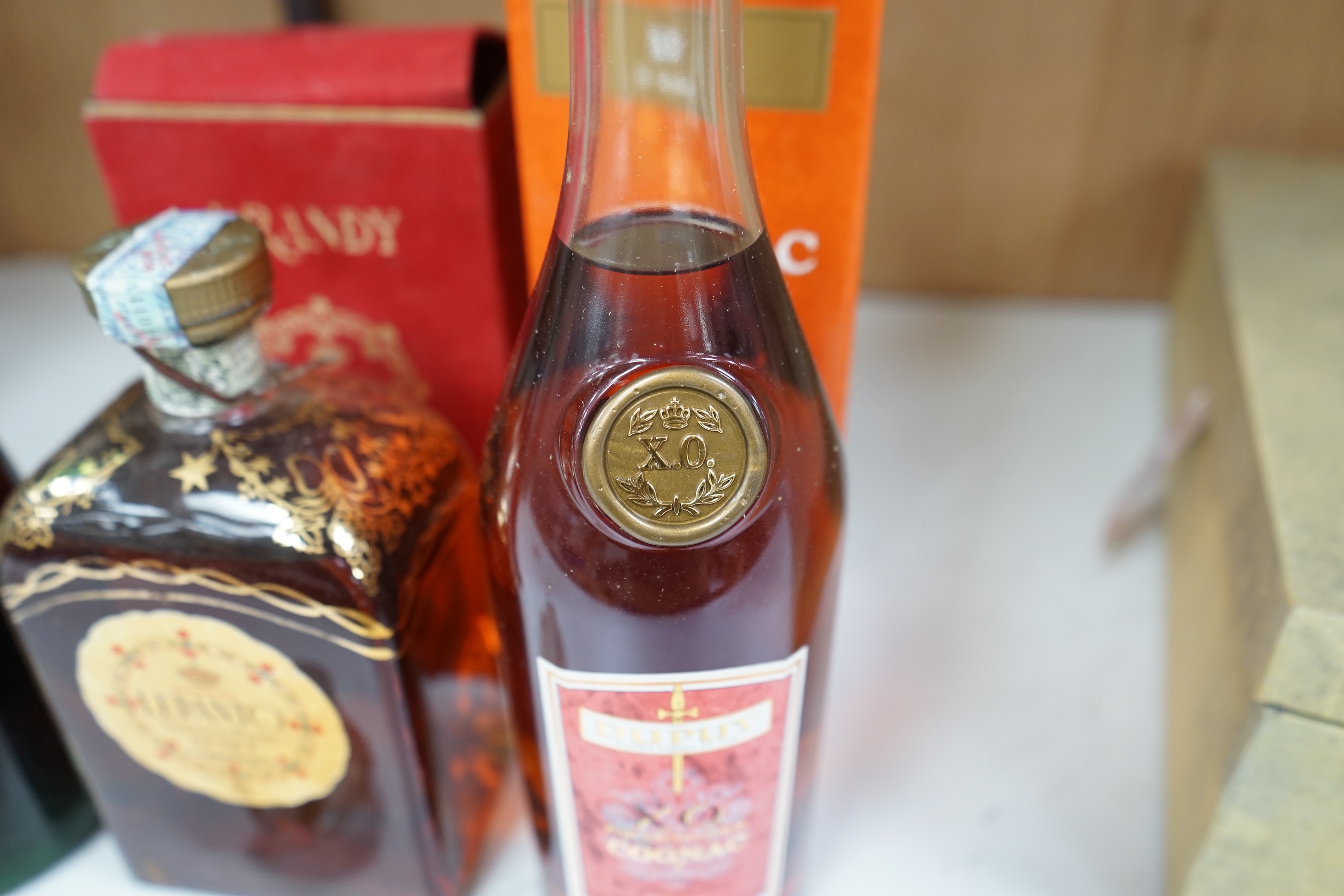 Three bottles of brandy comprising KWV Ten Year brandy, Dupuy cognac and Lepanto brandy. Condition - fair, storage history unknown